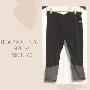 Black and grey leggings. Goes to the calf. Stretchy, breathable and comfortable.